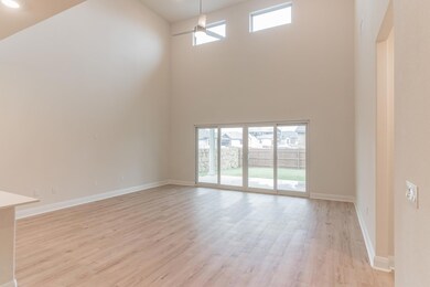 Unfurnished living room featuring a towering ceil