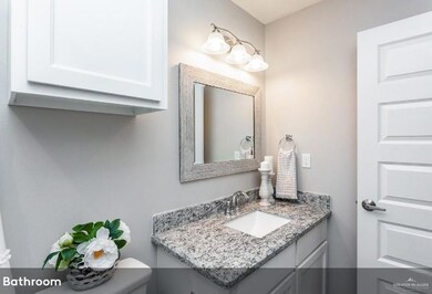 Half bathroom with toilet and vanity
