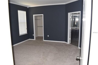 Master bedroom with his and her walk-in closets (2