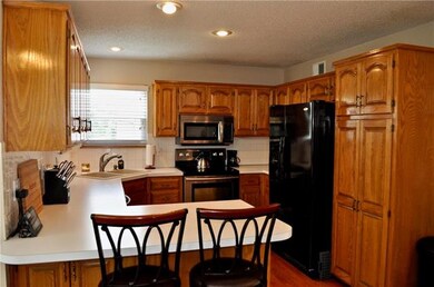 Tons of cabinets including a pantry and hardwood f