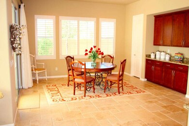 Spacious eat-in area is light & bright