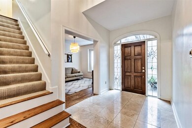 This open foyer welcomes you to this 3800+ square 