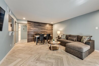Living room featuring light parquet floors