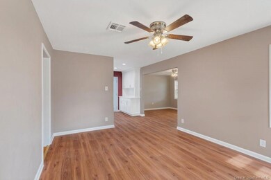 Living Room with View to Dining Room and Kitchen.
