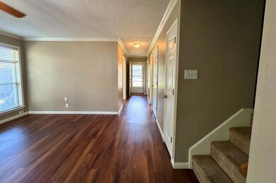 Hall featuring dark wood-style flooring, ornament