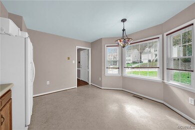Unfurnished dining area with a chandelier and ligh