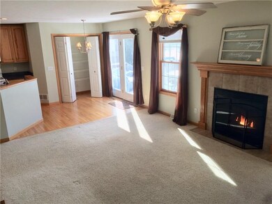 Gather 'round the hearth! The gas fireplace lights