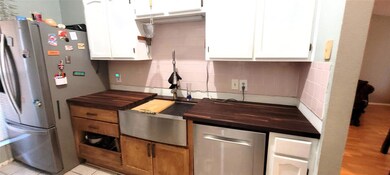 Updated kitchen with farm sink and dishwasher.