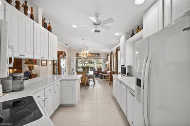 Kitchen with white appliances, recessed lighting, 