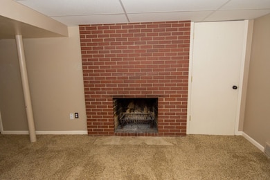 Finished lower level with wood burning fireplace a