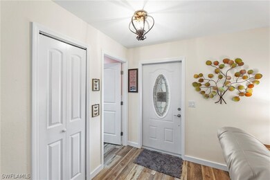 Front door and entry to home.. laundry and garage to the left