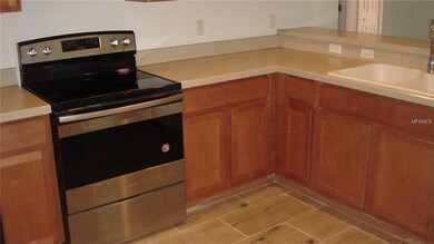 Kitchen has lots of counter space and pretty tile flooring