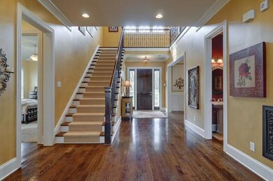 Such a grand entrance in this home with fantastic millwork throughout. 6in. base boards, crown molding, and wonderful staircase runner leading to the 2nd floor.