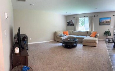 Living room featuring baseboards and wood finished floors