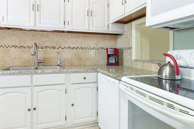 Wood cabinets, our LIGHT Gray. Granite counter tops, newer appliances less than 5 years old.