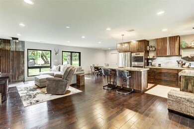 Kitchen featuring a center island, backsplash, op