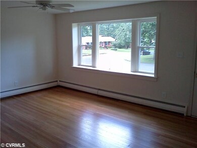 Living Room - Large picture window is new ( as are all the windows). Refinished hardwood floors throughout the house.