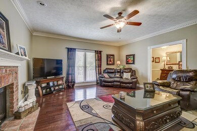 Great Room has Dental Moulding, fireplace and large windows