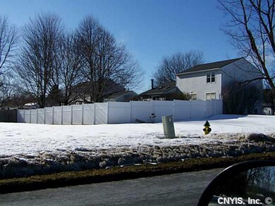 Exterior Back Fully fenced yard with deck and abov