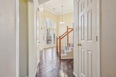 Entrance foyer featuring baseboards, a notable cha
