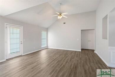 The great room highlights the beautiful flooring,