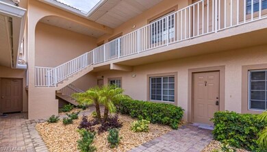Doorway to property featuring stucco siding