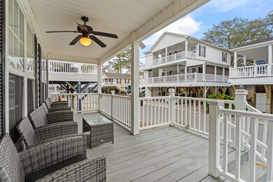Deck with an outdoor living space and ceiling fan