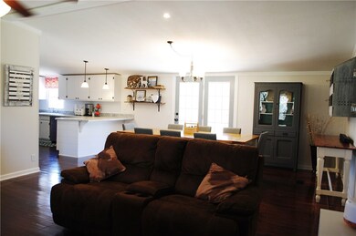 Living room looking into the dining room and kitch