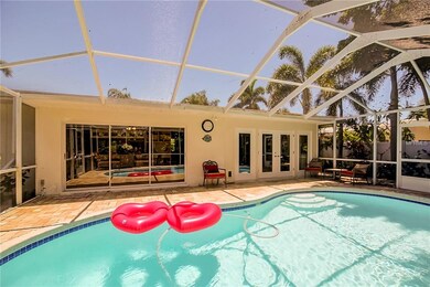 Pool is surrounded by Palm trees and hand laid pav