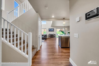 entry towards kitchen/dining/living