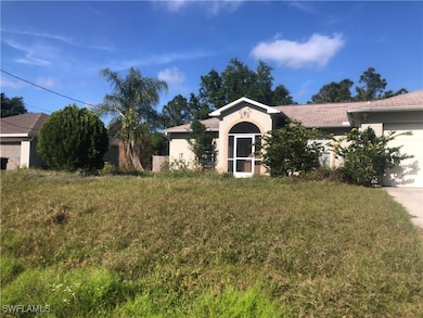 Single story home with a garage, driveway, a front