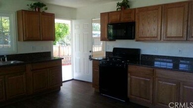 Additional View of Kitchen with Builtin Microwave 
