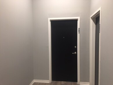 Doorway to outside featuring hardwood / wood-style