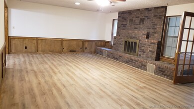 Large living room with new vinyl plank flooring.
