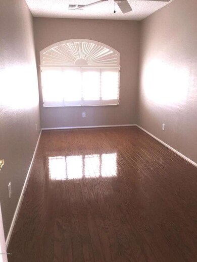 Bonus room off kitchen with wood floors