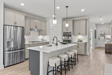 Photos of former Harrison plan built in a previous community. List price is for base home before buyer selects upgrades and finishes.