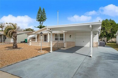 Extra wide driveway with carport