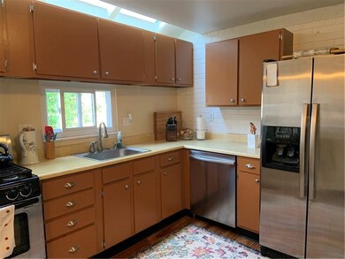 Kitchen with skylights and newer appliances.