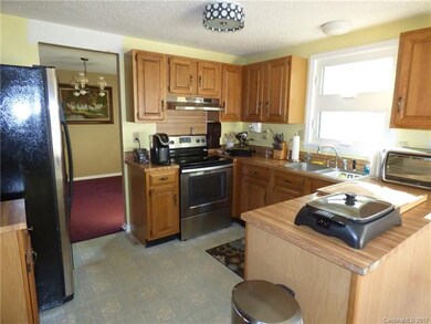 Bright kitchen flows to dining room and breakfast 