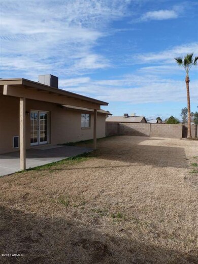 large covered patio and huge backyard
