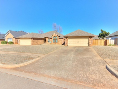 Single story home with brick siding, fence, concre