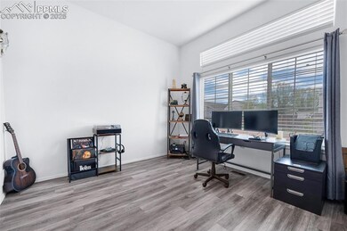 Office featuring wood finished floors and baseboards