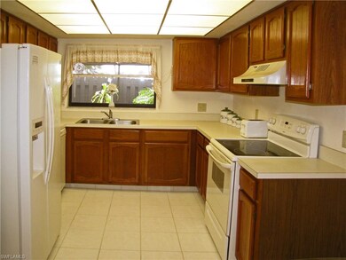 Solid wood cabinetry with newer appliances