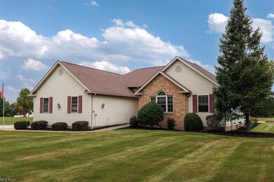 Single story home with a front yard