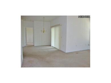 Living room looking to dining room and patio doors