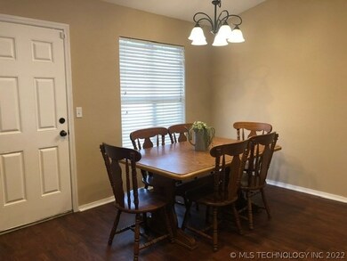 Eating area in kitchen has plenty of room. Door th