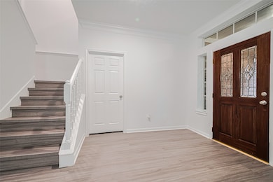 Spacious foyer with stairway and open layout leadi