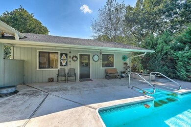 Pool house features a bedroom / bathroom / kitchen