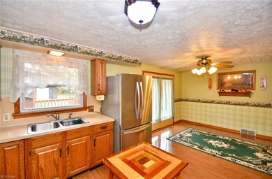 Large doors lead to expansive deck and attached ga