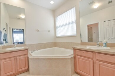 Master bath with garden tub and two vanities